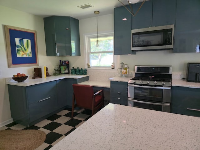 2914 Sue Mack Dr, Columbus, GA 31906 - kitchen featuring stainless steel appliances, tile patterned floors, and decorative light fixtures