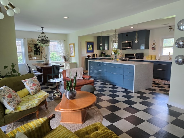 2914 Sue Mack Dr, Columbus, GA 31906 - living area featuring dark flooring, plenty of natural light, a chandelier, and recessed lighting