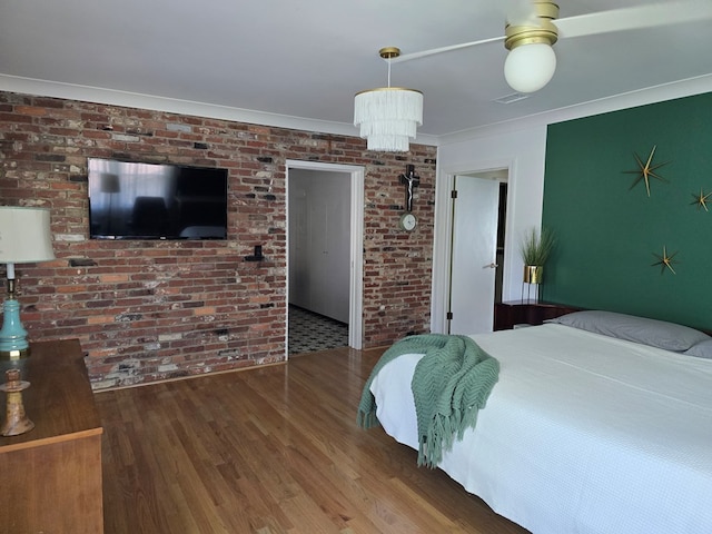 2914 Sue Mack Dr, Columbus, GA 31906 - bedroom with wood finished floors, brick wall, and ornamental molding