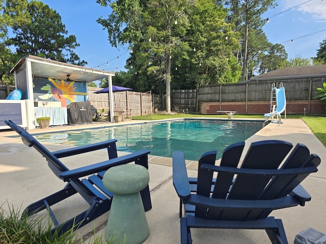 2914 Sue Mack Dr, Columbus, GA 31906 - view of swimming pool featuring a water slide, a fenced backyard, a patio, and area for grilling