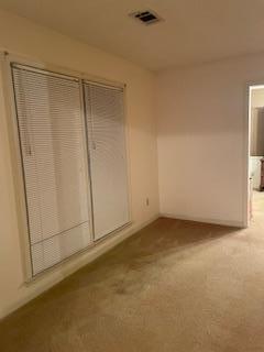 unfurnished bedroom with light colored carpet