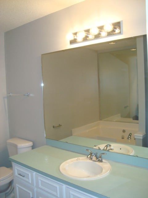 4118 Terrace Pointe Dr, Columbus, GA 31909 - full bathroom with vanity and a textured ceiling