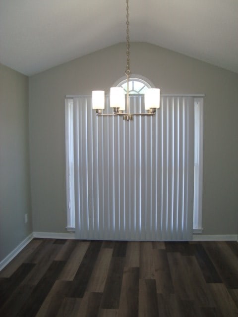 4118 Terrace Pointe Dr, Columbus, GA 31909 - unfurnished dining area featuring a chandelier, vaulted ceiling, and wood finished floors