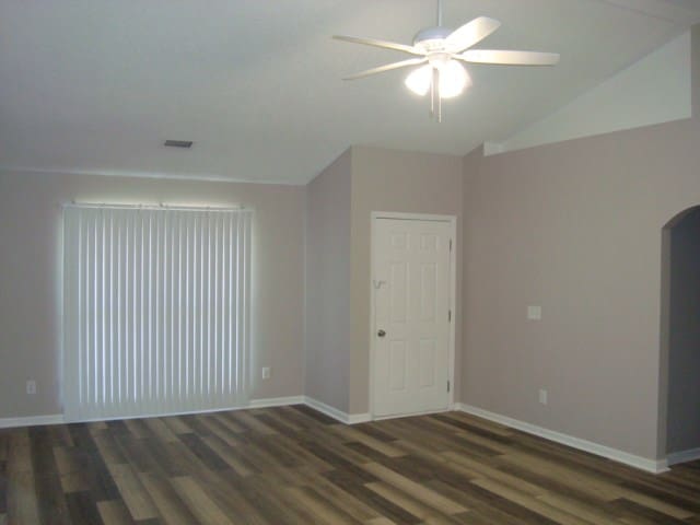 4118 Terrace Pointe Dr, Columbus, GA 31909 - unfurnished room featuring ceiling fan, lofted ceiling, wood finished floors, and arched walkways
