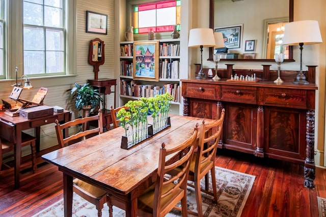 living area with plenty of natural light and dark wood-type flooring