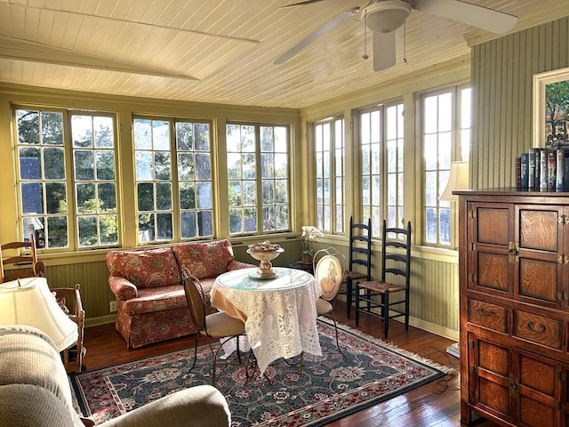 sunroom featuring a healthy amount of sunlight, lofted ceiling, and wooden ceiling