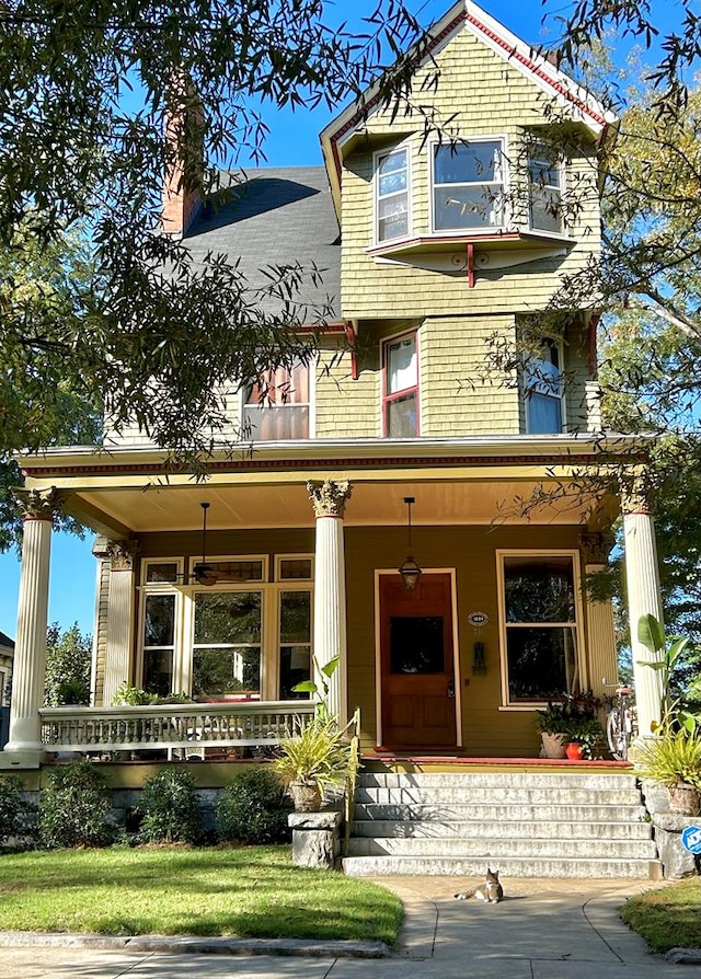 victorian-style house featuring covered porch