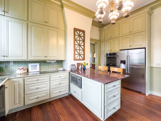 kitchen with pendant lighting, ornamental molding, dark hardwood / wood-style flooring, kitchen peninsula, and stainless steel appliances