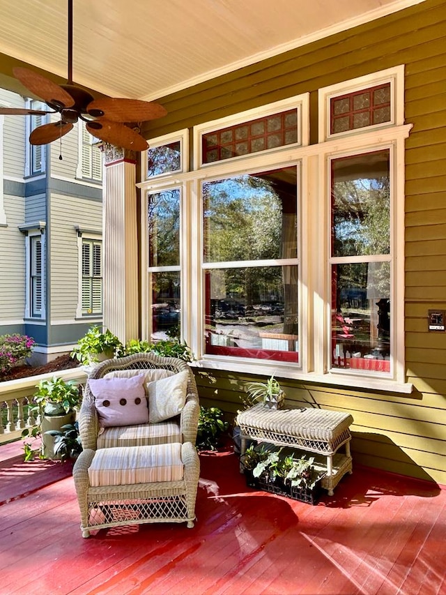 sunroom featuring ceiling fan