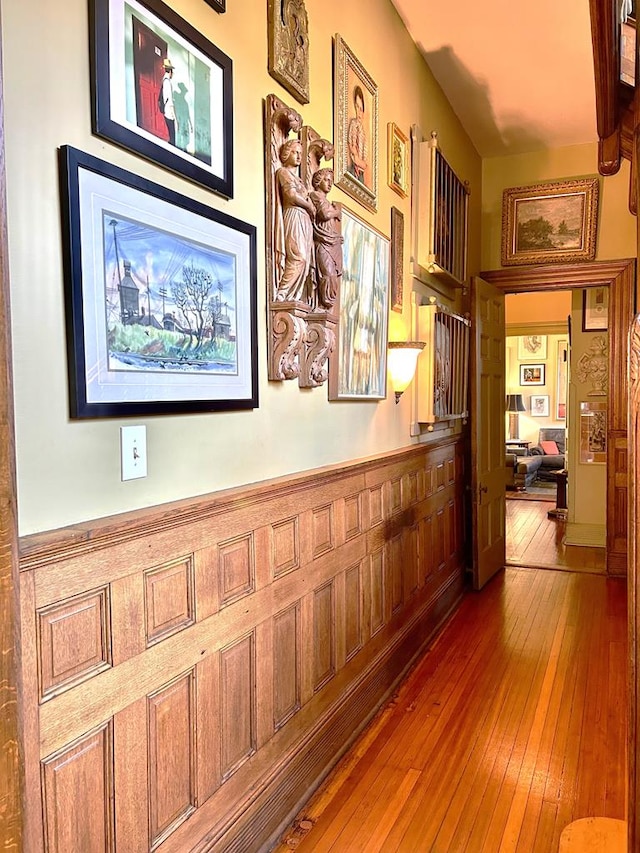 corridor featuring wood-type flooring