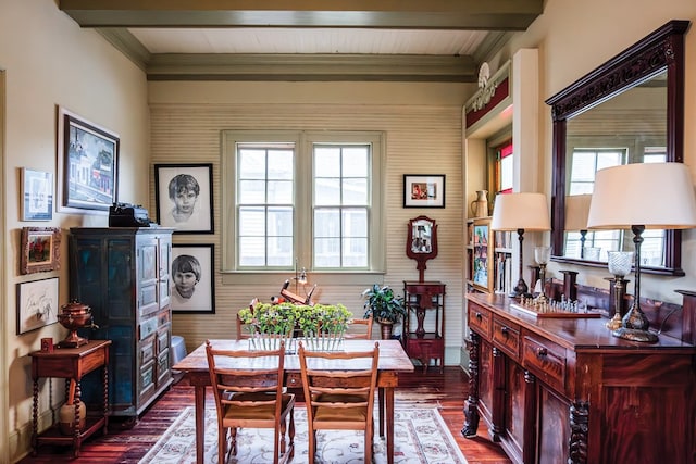 dining area with plenty of natural light, beamed ceiling, ornamental molding, and hardwood / wood-style flooring