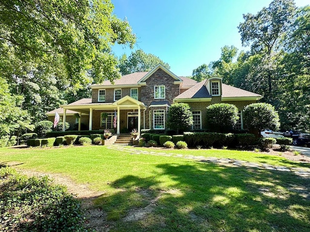 105 Lake View Dr, Hamilton, GA 31811 - view of front facade with a front yard, covered porch, and stone siding