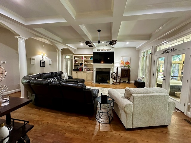 105 Lake View Dr, Hamilton, GA 31811 - living area with ornate columns, a ceiling fan, coffered ceiling, a fireplace with flush hearth, and wood finished floors
