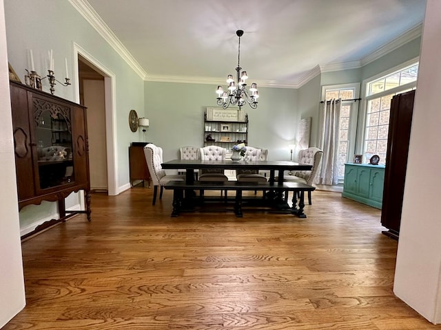 105 Lake View Dr, Hamilton, GA 31811 - dining room featuring a chandelier, wood finished floors, and crown molding
