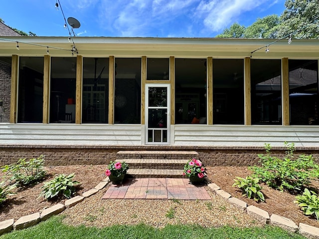 105 Lake View Dr, Hamilton, GA 31811 - rear view of house with a sunroom