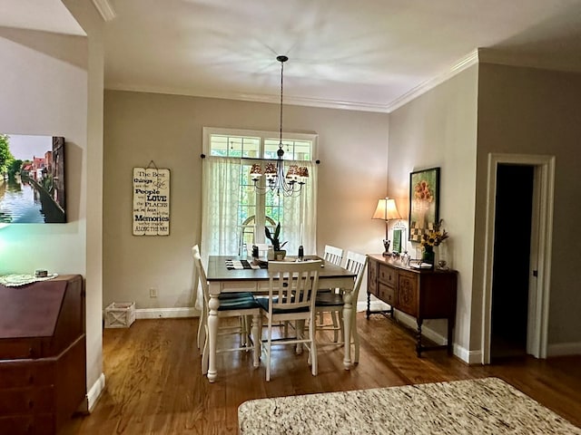105 Lake View Dr, Hamilton, GA 31811 - dining room with wood finished floors, ornamental molding, and a chandelier