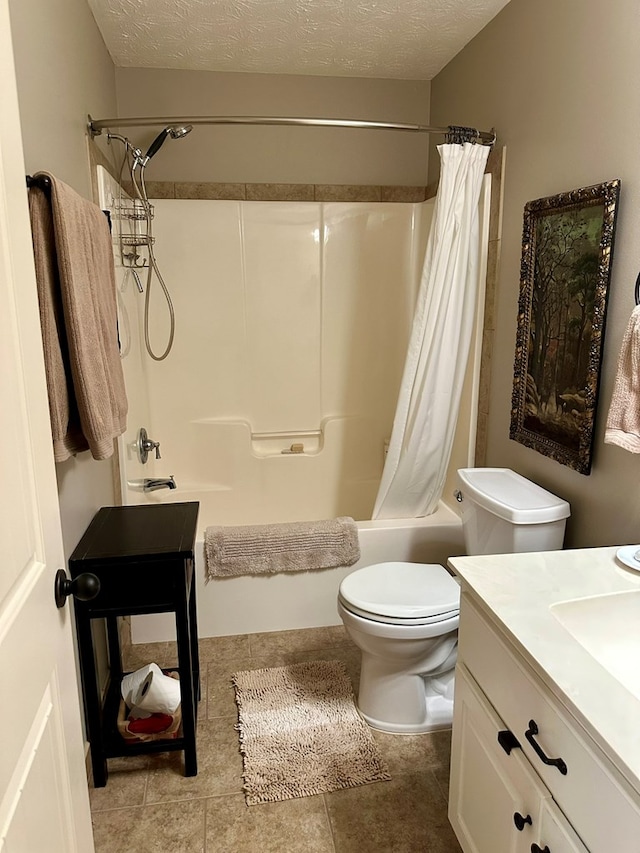 full bath with a textured ceiling, vanity, tile patterned floors, toilet, and shower / bath combo with shower curtain