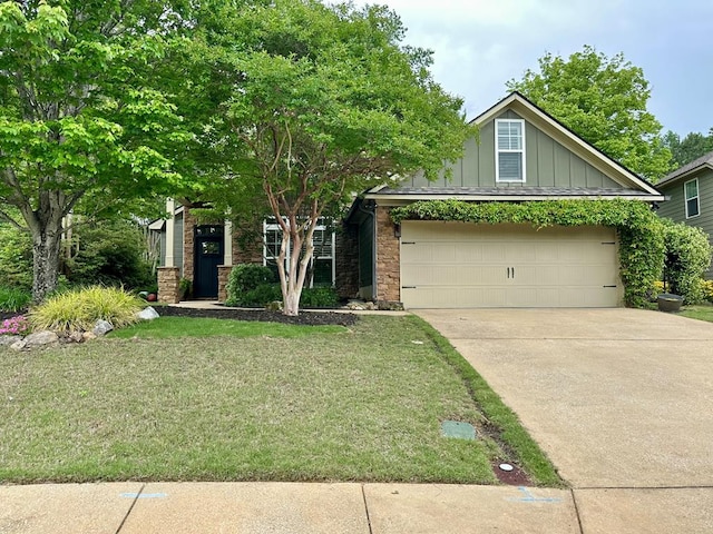 view of front of home with board and batten siding, driveway, a front lawn, an attached garage, and stone siding