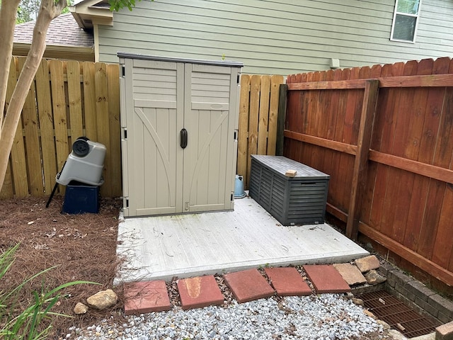 view of shed with a fenced backyard