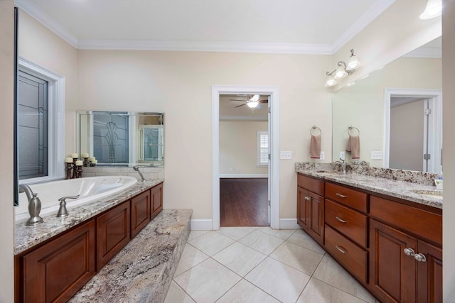 bathroom featuring crown molding, double vanity, a sink, tile patterned flooring, and a bath