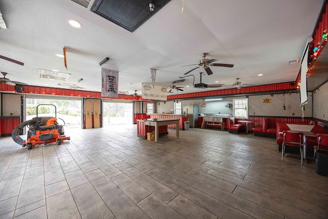 interior space featuring a textured ceiling, wood finished floors, visible vents, and recessed lighting