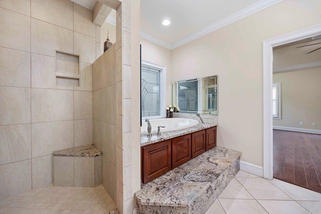 full bath featuring a garden tub, crown molding, a walk in shower, baseboards, and tile patterned floors