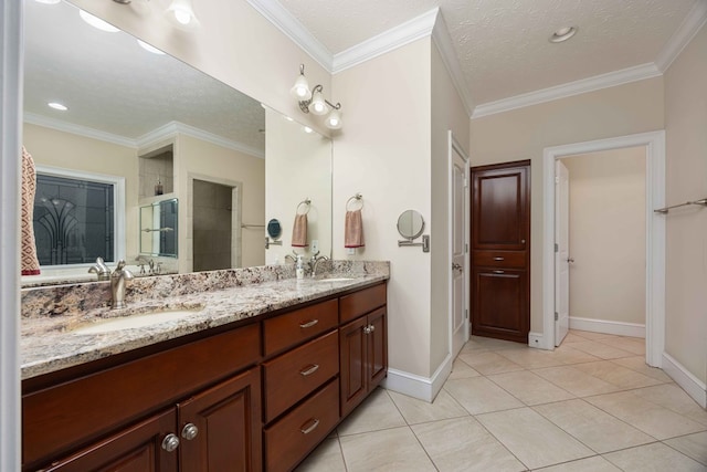 full bath featuring double vanity, a stall shower, tile patterned flooring, and a sink