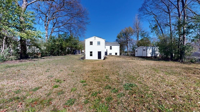 view of yard with a storage unit and an outdoor structure