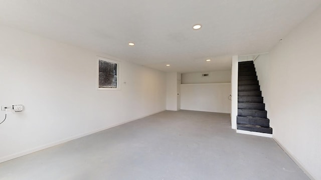 finished below grade area featuring recessed lighting, stairway, baseboards, and visible vents