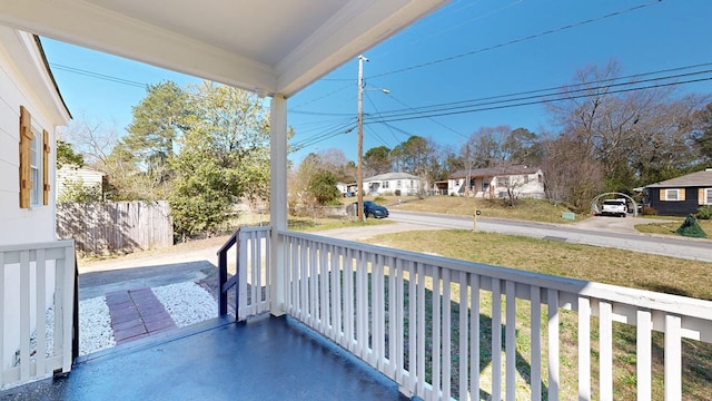 balcony featuring a residential view and covered porch