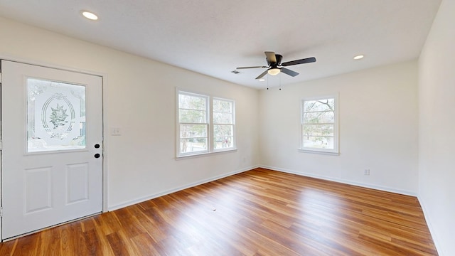 entryway featuring visible vents, recessed lighting, baseboards, and wood finished floors