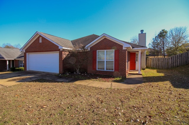 ranch-style home featuring a garage and a front yard