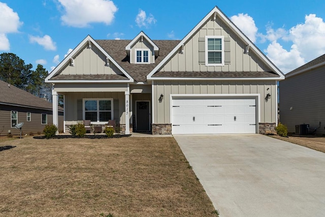 craftsman-style house featuring concrete driveway, a porch, board and batten siding, and central air condition unit