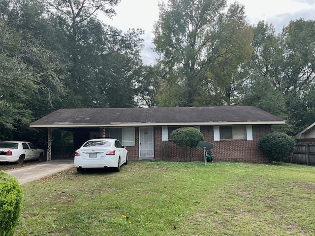 single story home featuring a front yard and a carport