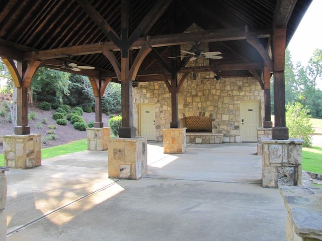 7715 Lynch Rd, Midland, GA 31820 - view of patio / terrace with an outdoor stone fireplace, a ceiling fan, and a gazebo