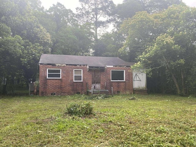1114 Brooks Rd, Columbus, GA 31903 - view of front facade featuring a front yard and brick siding