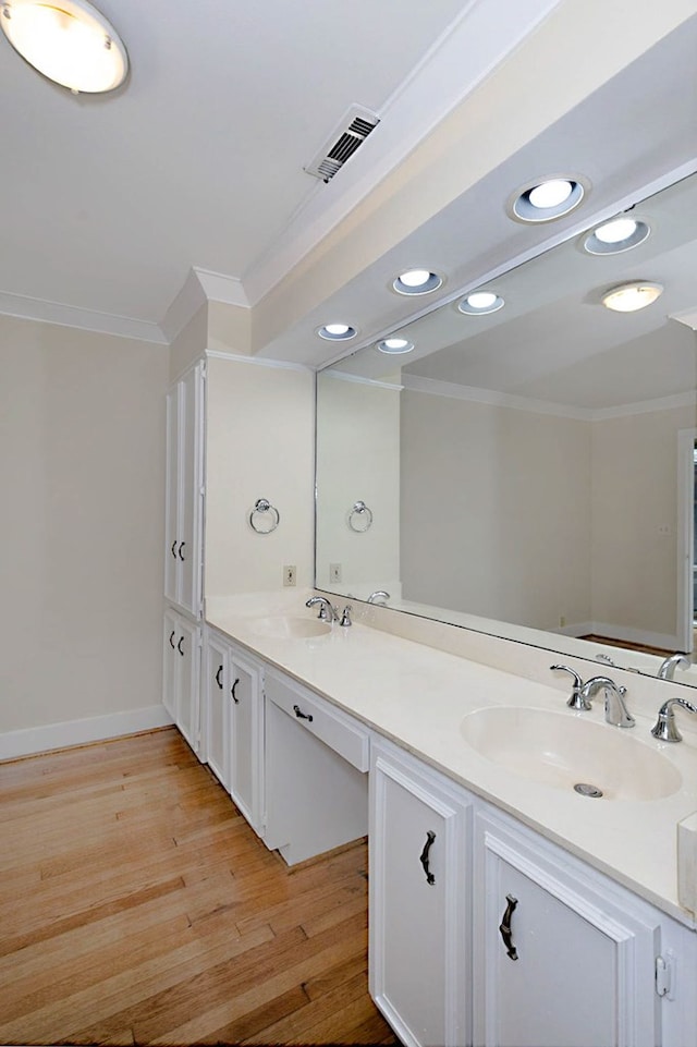 2707 Lookout Dr, Columbus, GA 31906 - bathroom featuring ornamental molding, double vanity, wood finished floors, and recessed lighting