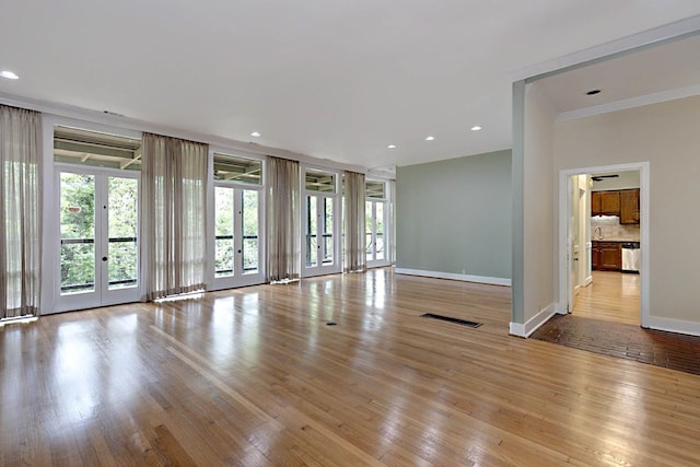 2707 Lookout Dr, Columbus, GA 31906 - unfurnished living room with plenty of natural light, light wood-style floors, crown molding, and recessed lighting
