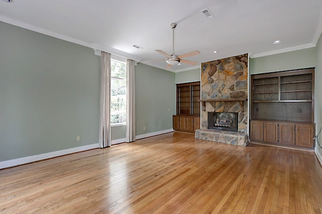 2707 Lookout Dr, Columbus, GA 31906 - unfurnished living room featuring ornamental molding, light wood-style floors, a ceiling fan, and a fireplace