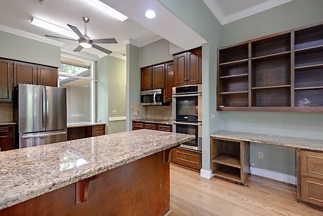 2707 Lookout Dr, Columbus, GA 31906 - kitchen with stainless steel appliances, crown molding, light wood finished floors, tasteful backsplash, and light stone counters