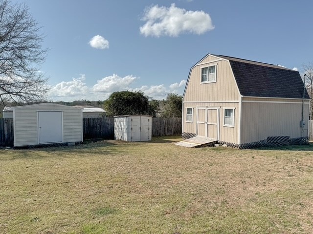 view of shed featuring fence