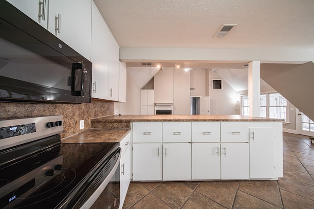 kitchen with white cabinetry, electric range, and kitchen peninsula