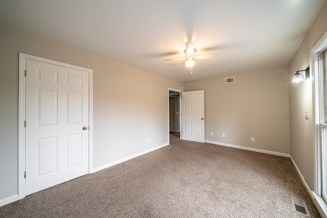 unfurnished bedroom with ceiling fan and carpet flooring