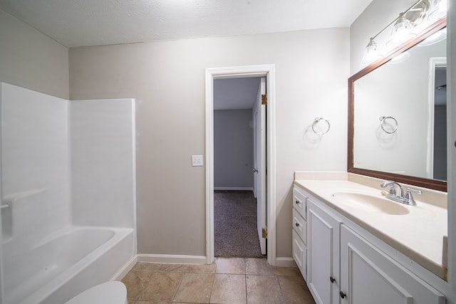 full bathroom with shower / bathing tub combination, vanity, toilet, tile patterned floors, and a textured ceiling