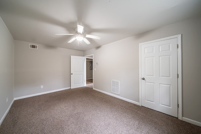 spare room with ceiling fan and carpet flooring