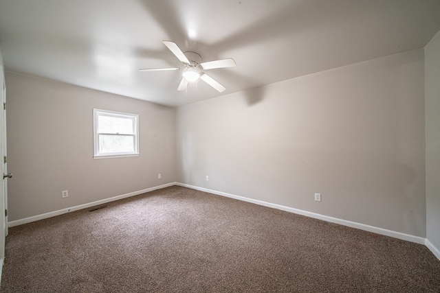 spare room with carpet and ceiling fan