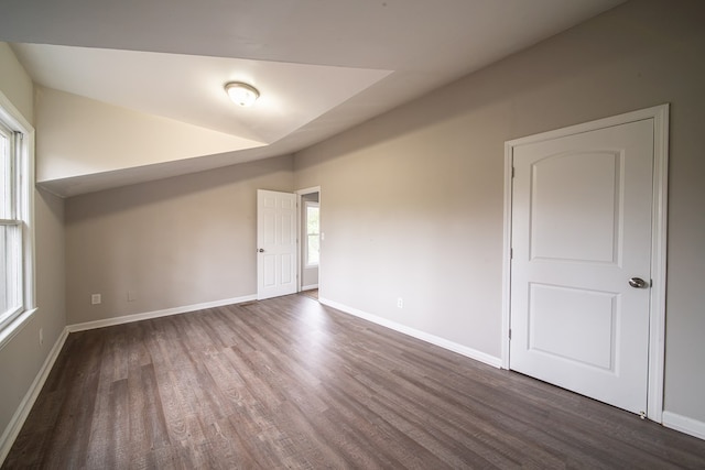 spare room with dark hardwood / wood-style flooring