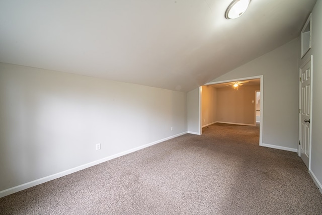 additional living space with lofted ceiling and carpet floors