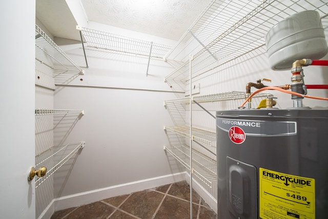 walk in closet featuring water heater