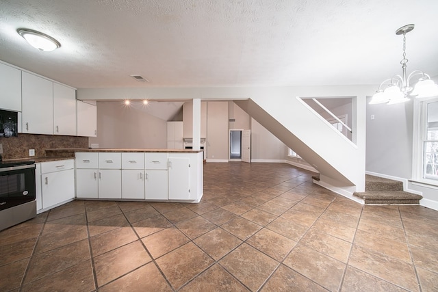 kitchen featuring white cabinetry, tasteful backsplash, electric range, kitchen peninsula, and pendant lighting